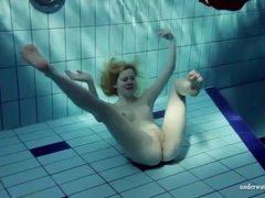 AlphaTeenies presents: Blonde goes for a swim and strips