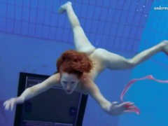 AlphaTeenies presents: Curly hair redhead swims and looks sexy