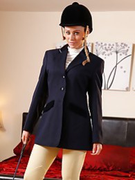 AlphaTeenies presents: Clare R seductifvely removes her riding gear leaving on only opaque hold ups and sheer underwear